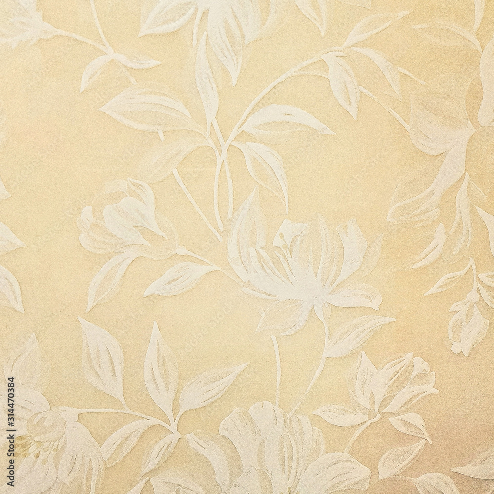 Yellow ceramic tile with white floral pattern for wall and floor decoration. Concrete stone surface background. Modern texture for interior design project.