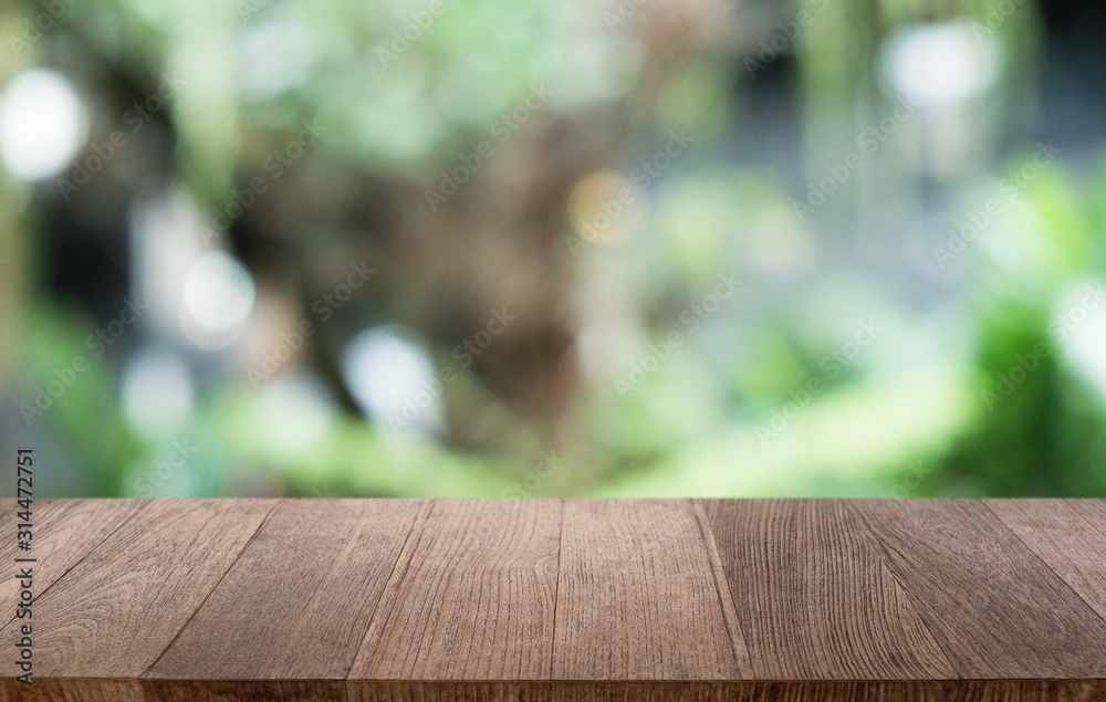 Empty dark wooden table in front of abstract blurred bokeh background of restaurant . can be used for display or montage your products.Mock up for space. Empty dark wooden table in front of abstract blurred bokeh background of restaurant . can be used for display or montage your products.Mock up for space.