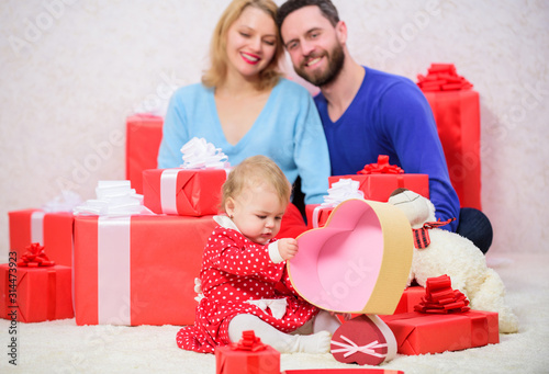 best Valentines day. Red boxes. Shopping online. Boxing day. Love and trust in family. Bearded man and woman with little girl. father, mother and doughter child. Happy family with present box