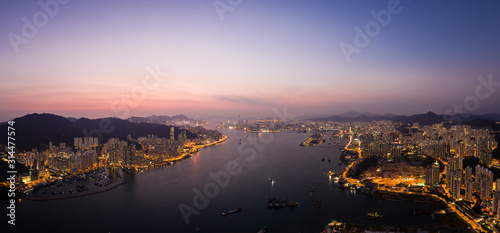 Aerial panorama of the sunset over Hong Kong island and the Victoria harbor from the Devil's peak in Kowloon