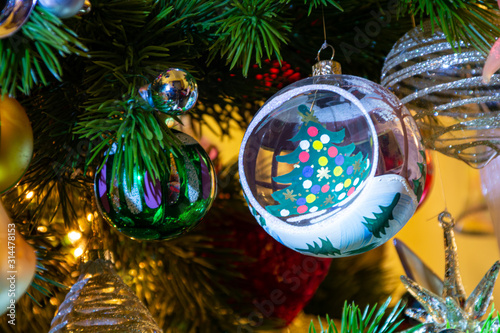 Christmas ball on a Christmas tree, colorful lights 