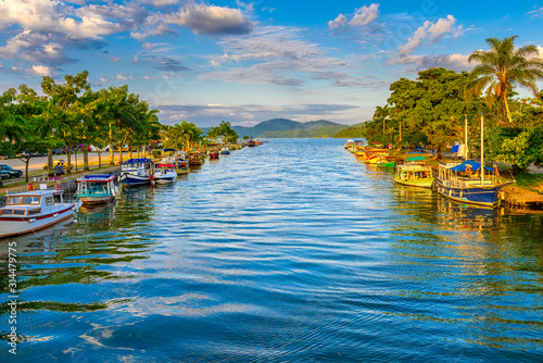 Canal in historical center of Paraty, Rio de Janeiro, Brazil. Paraty is a preserved Portuguese colonial and Brazilian Imperial municipality. Cityscape of Paraty photo