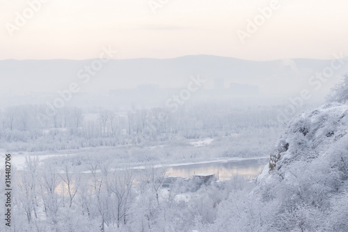 Winter landscape - foggy view of the cliff edge and into the dis © ok_fotoday
