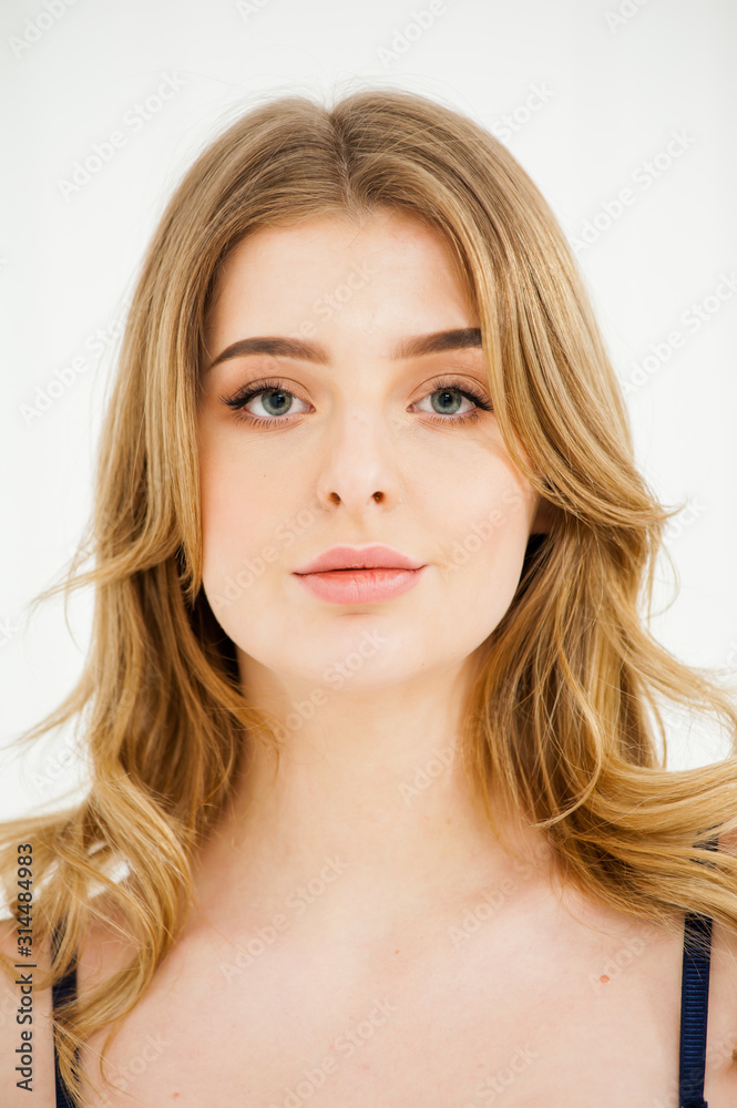 Fototapeta premium Gentle portrait of young healthy blond woman underwear near light window