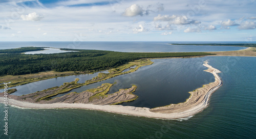 Aerial view over complex coastal development - the gravel spits created by storms forming new emerging seacoast, isolating sea bay into coastal lagoon. Harilaid, Vilsandi national park, Estonia photo