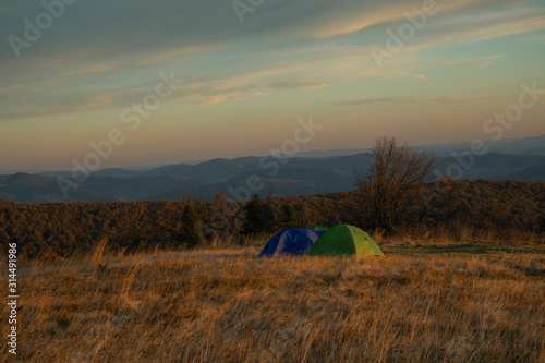tent camp touristic hobby passion concept landscape photography highland mountain scenic environment evening twilight lighting autumn cold season weather time