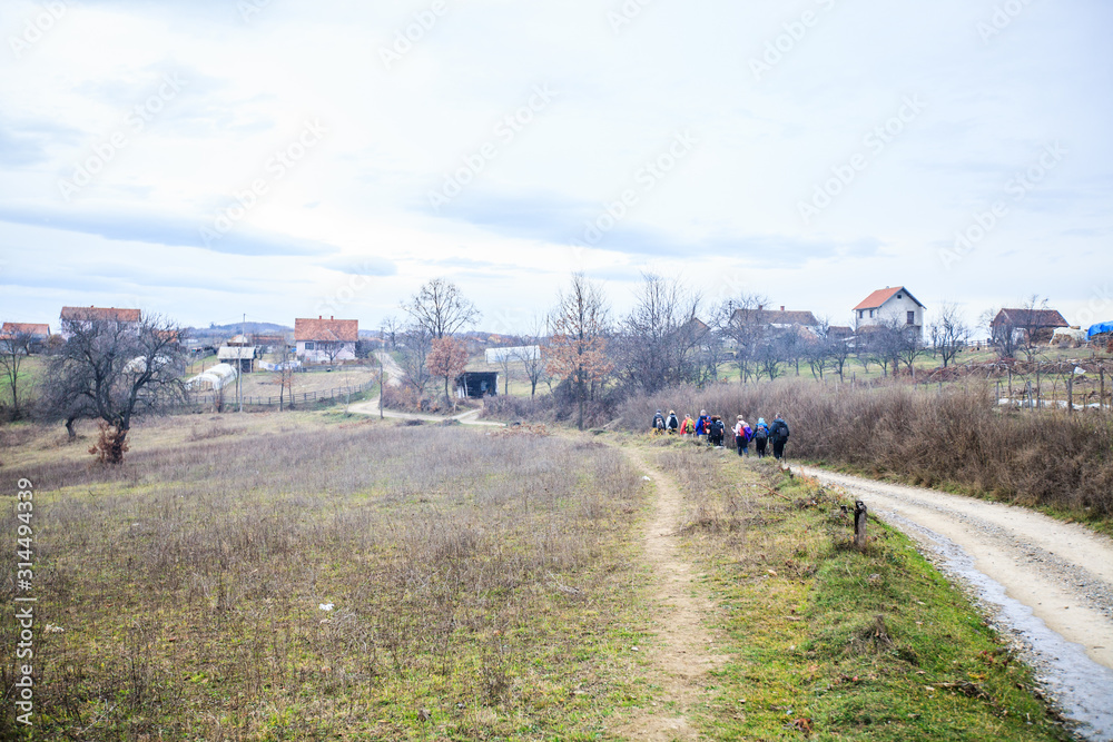 active people trekking on rural landscape active people trekking on rural landscape