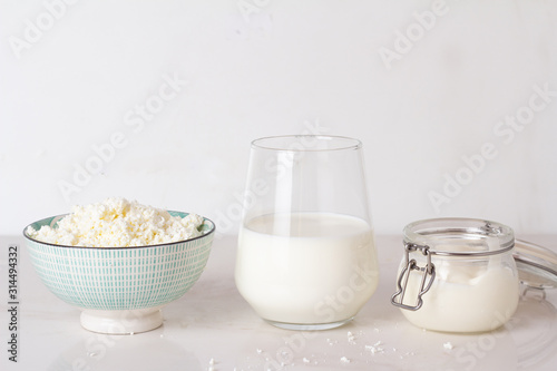 cottage cheese, milk and yogurt on a white background