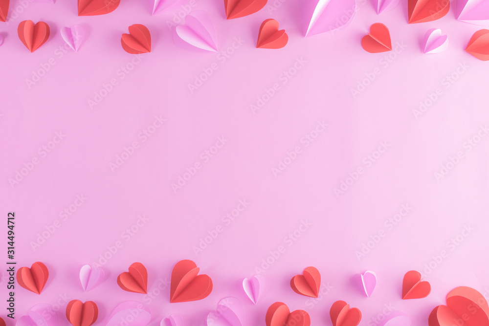 Backgrounds for Valentines day with pink and red hearts on pastel pink paper background. Banner, website, postcard, background.
