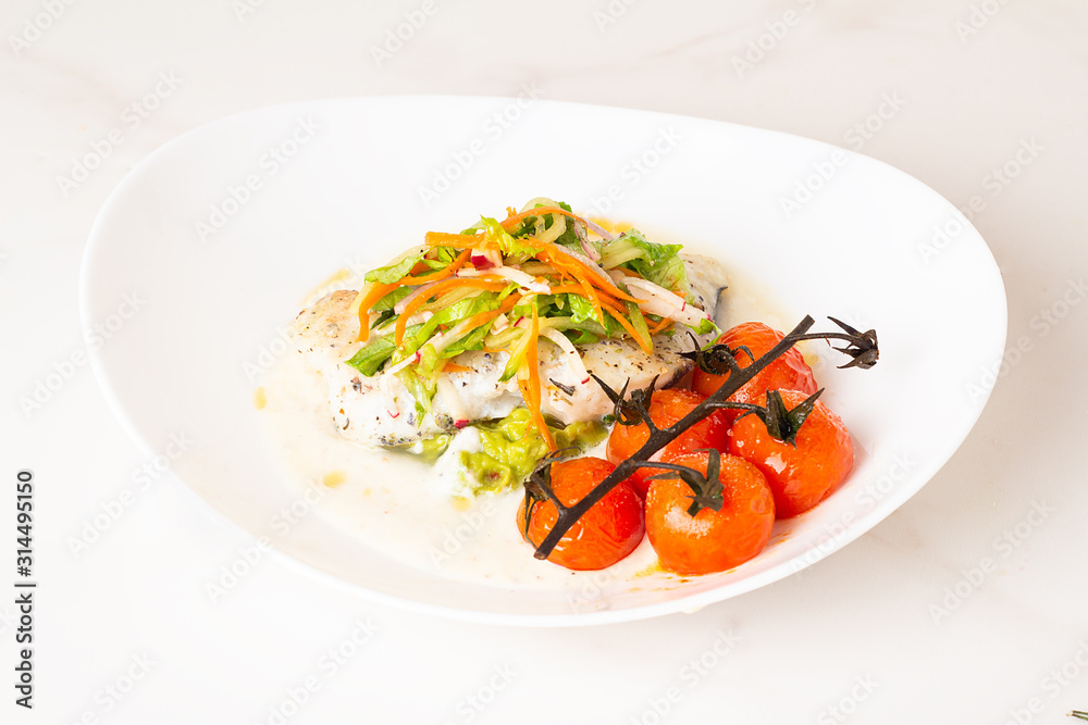 fish with avocado sauce and salad