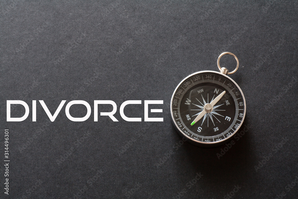 Divorce word written on black background with compass Divorce word written on black background with compass