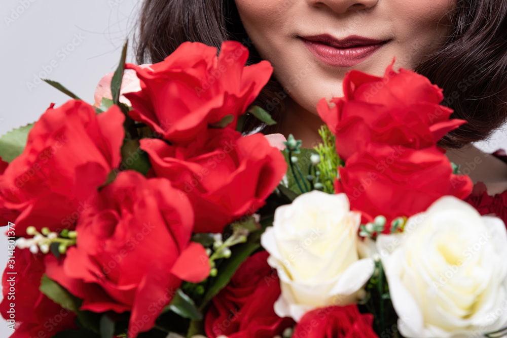 Smiling of beautiful lady with rose in many color. There are red,white and pink rose for tell love someone,special day, Valentine's day. Smiling of beautiful lady with rose in many color. There are red,white and pink rose for tell love someone,special day, Valentine's day.