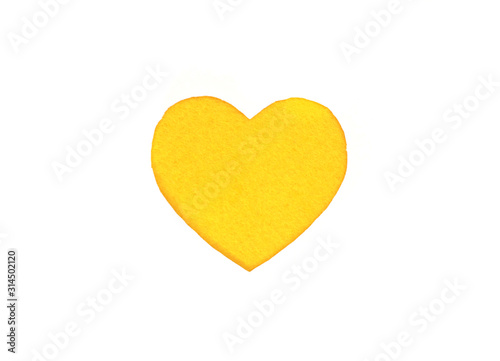 Оne felt yellow heart on a white isolated background. Stock photo for the day of St. Valentine with empty space for your text. For web, print, postcards and wallpaper.