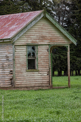 Abandoned wooden schoolbuilding. Blackmount Road. Invercargill. New Zealand. South Island. Coast