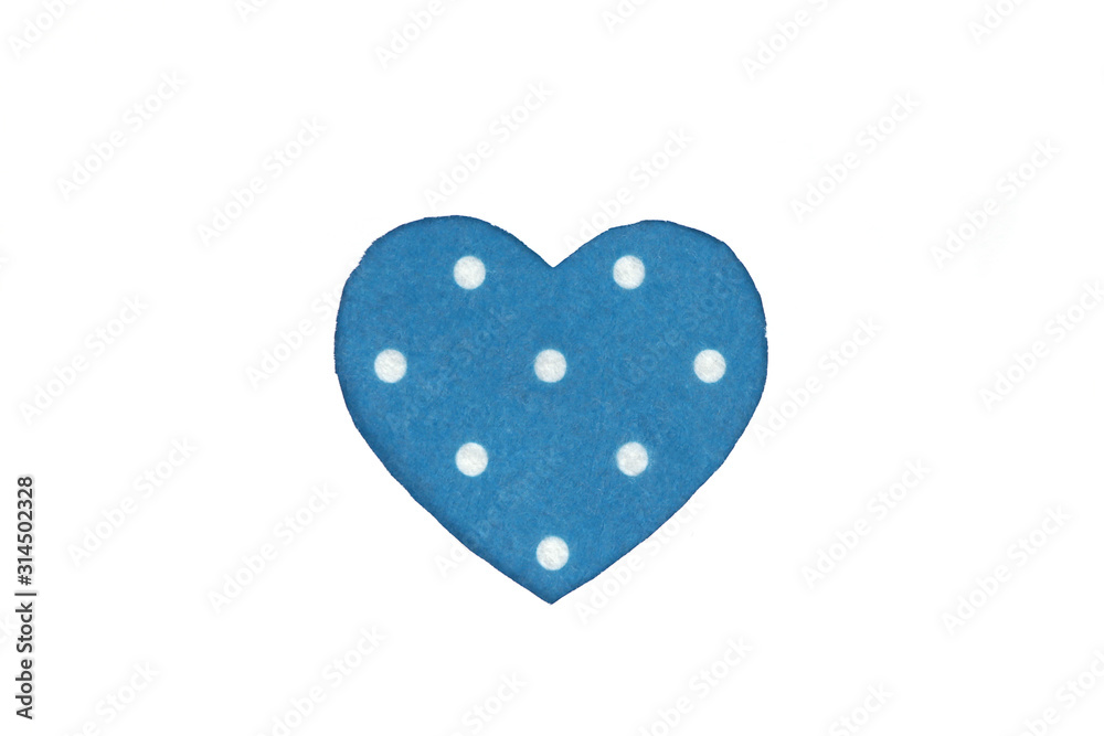Оne blue with white polka dot color felt  heart on a white isolated background. Stock photo for the day of St. Valentine with empty space for your text. For web, print, postcards and wallpaper.