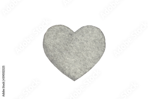   ne gray felt heart on a white isolated background. Stock photo for the day of St. Valentine with empty space for your text. For web  print  postcards and wallpaper.