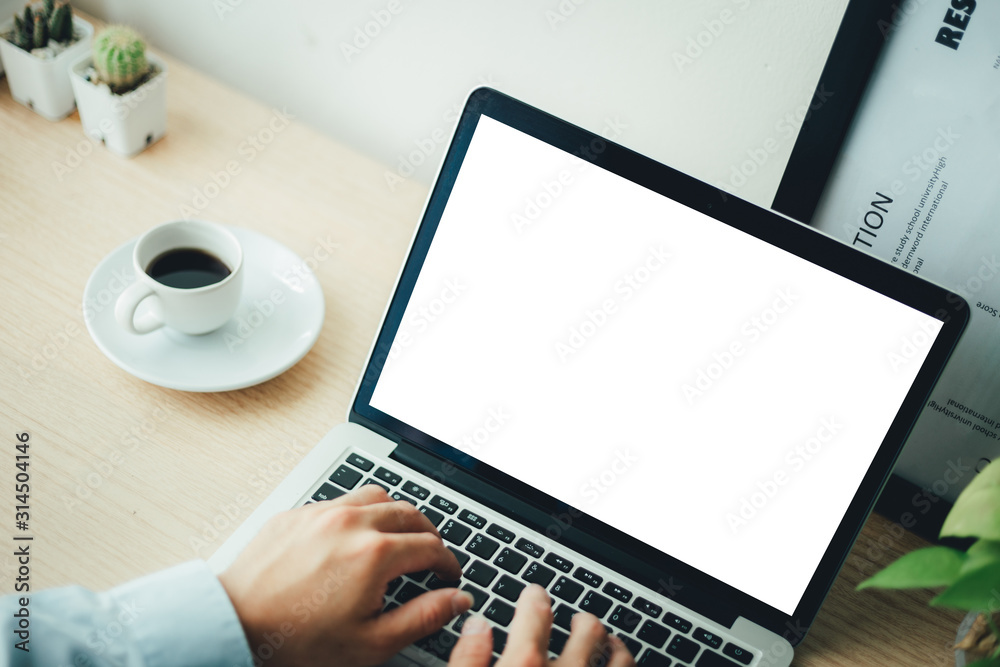 mockup image blank screen computer with white background for advertising text,hand man using laptop contact business search information on desk at coffee shop.marketing and creative design mockup image blank screen computer with white background for advertising text,hand man using laptop contact business search information on desk at coffee shop.marketing and creative design