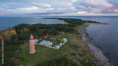 Aerial view over sunset and autumn colored Mohni island with the historic lighthouse, situating in the Finnish gulf of the Baltic sea, belonging to the Lahemaa national park photo