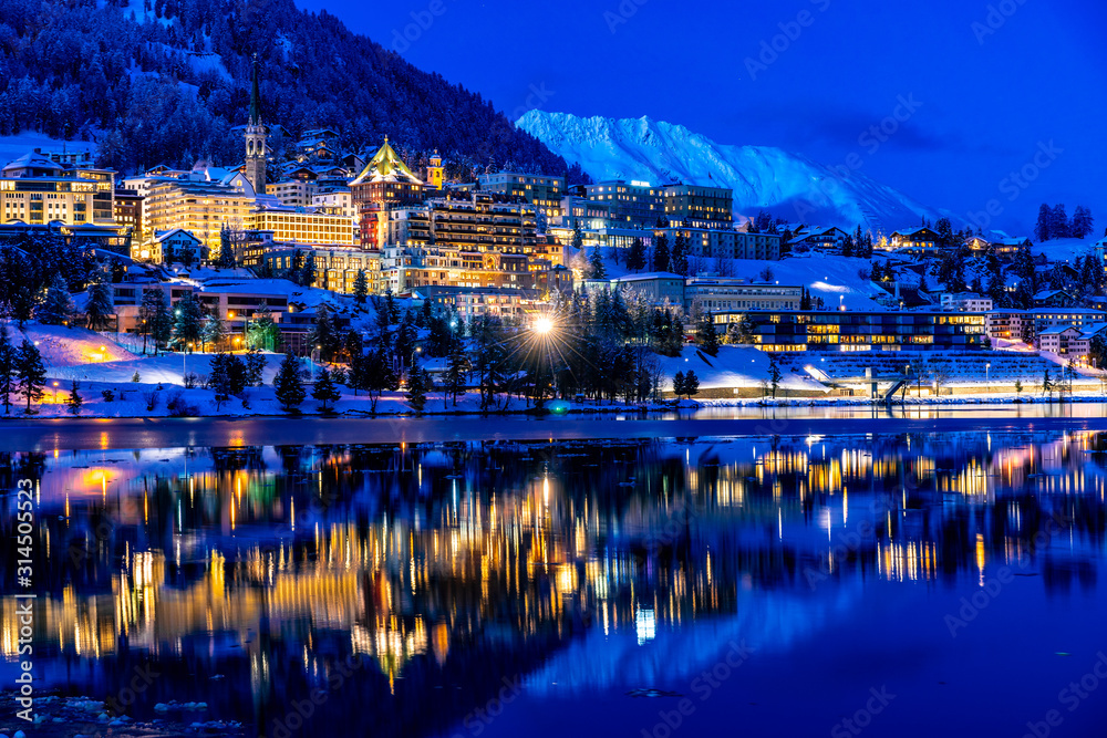 View of St. Moritz in Switzerland at night in winter - obrazy, fototapety, plakaty 