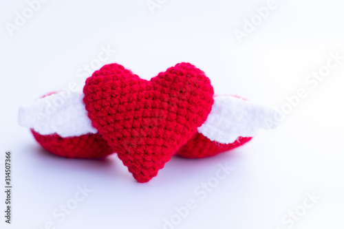 Beautiful red heart on a natural bokeh background. Valentine s Day .