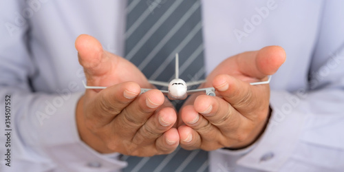 Insurance travel concept  Airplane model on Support hands  Protection plane safe protect