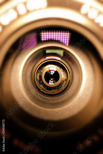 The photographer's business card.Camera lens in the background for conceptual design. Dark background. Technological concept. Business concept.