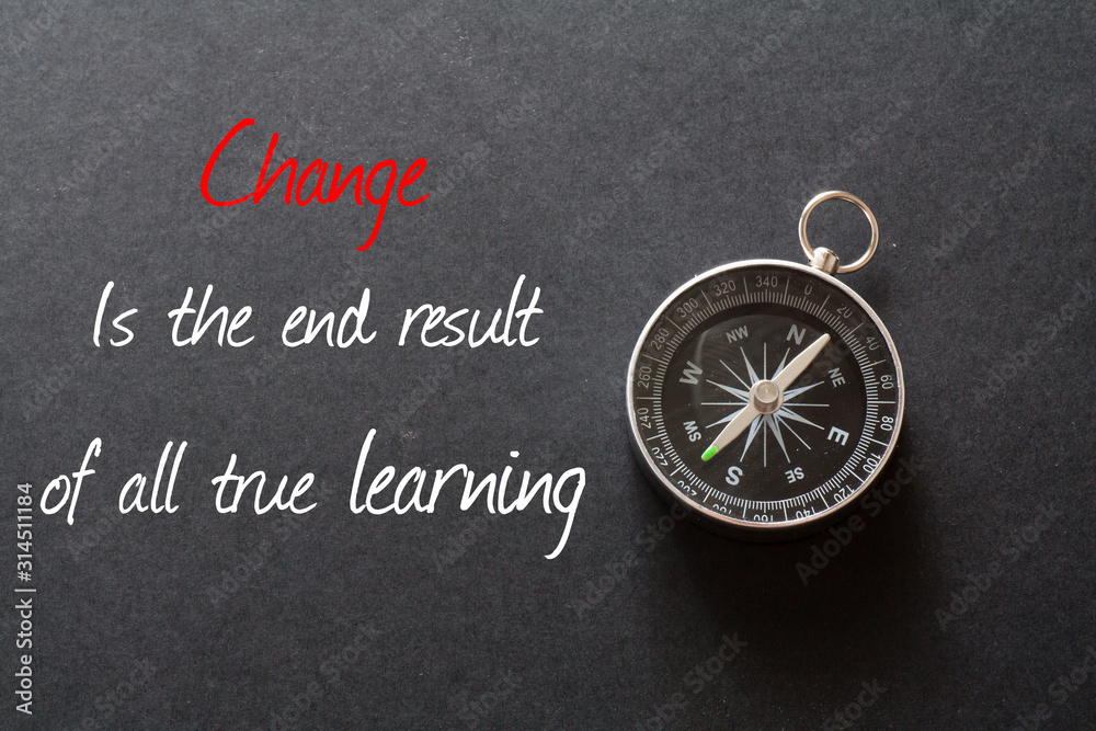 Inspirational quote : Change is the end result of all true learning ,on black background with compass Inspirational quote : Change is the end result of all true learning ,on black background with compass