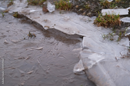 Snow debris stepped on by car.