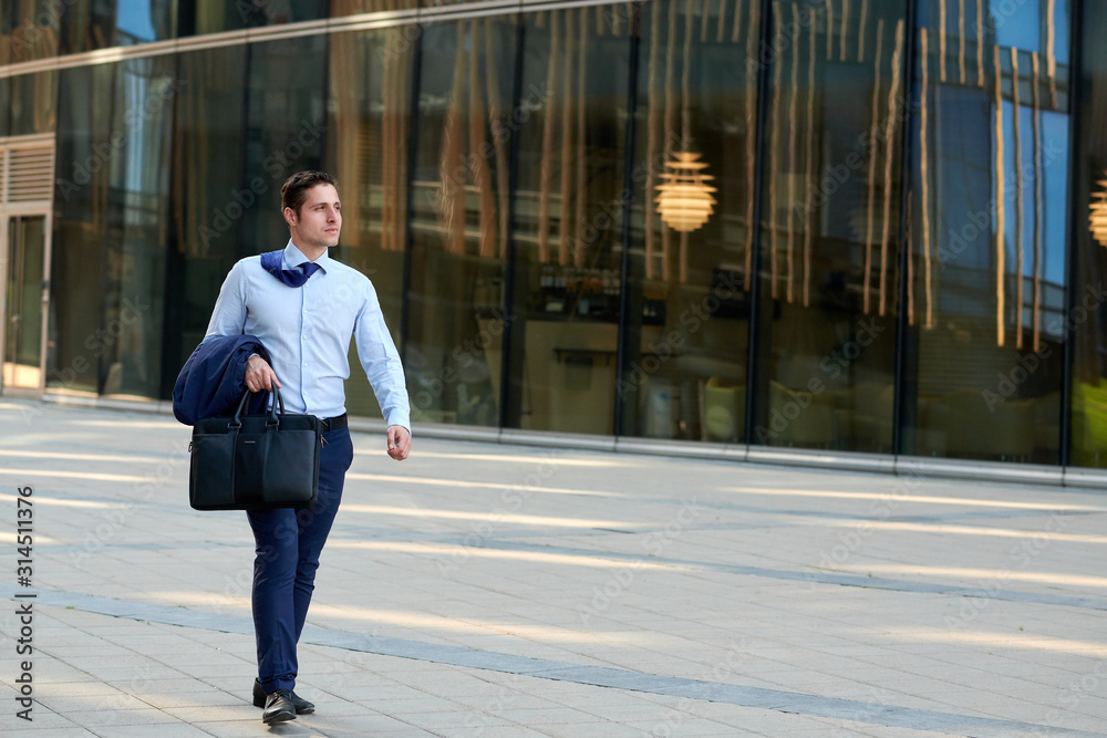 Fast walking businessman hurring to the meeting during hot wheather Fast walking businessman hurring to the meeting during hot wheather