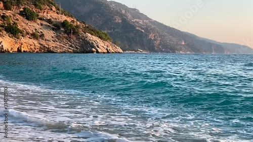 Seaview with beautiful water and mountains. Summer sea waves. Vacation concept. Slow motion video