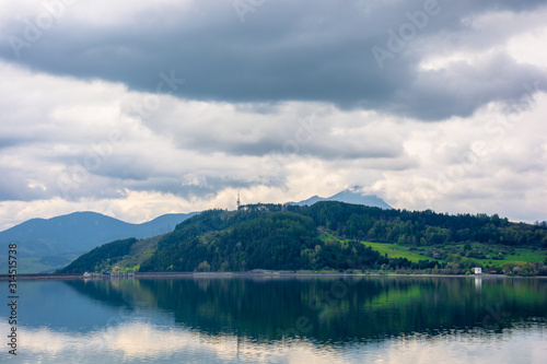 lake liptovska mara in slovakia. wondeful travel destination of high tatras mountain ridge. cloudy weather in springtime. reflection in the water