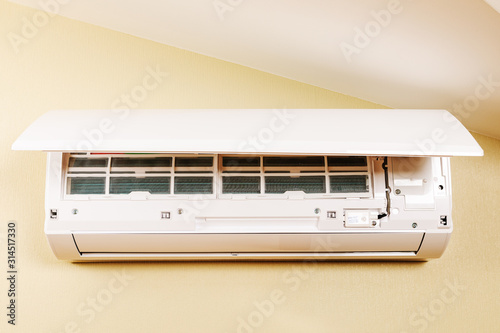 white split air conditioner on a wall. closeup image