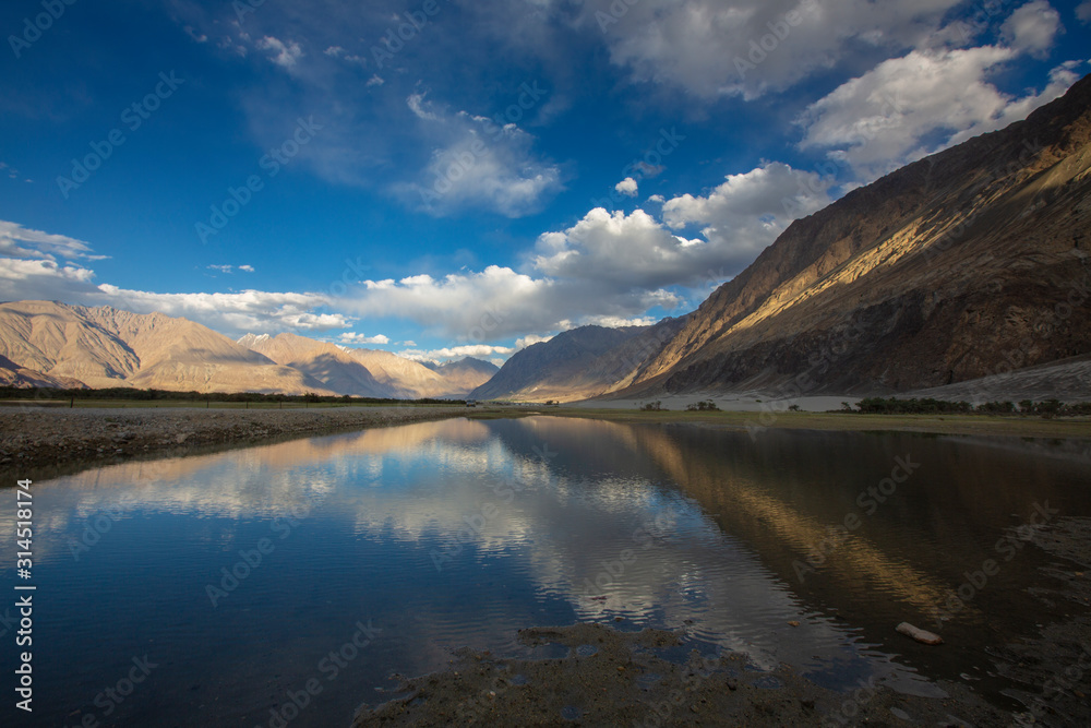Reflection of mountains in waterbody at  Nubra Valley, Ladakh, India, Asia