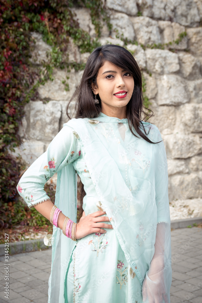 Bracelets on the girl's hands. Traditional accessories of Indian girls. Girl in traditional Indian clothing, salwar kameez. Bracelets on the girl's hands. Traditional accessories of Indian girls. Girl in traditional Indian clothing, salwar kameez.