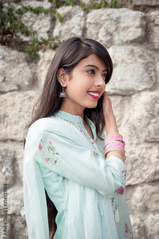 Bracelets on the girl's hands. Traditional accessories of Indian girls. Girl in traditional Indian clothing, salwar kameez. Bracelets on the girl's hands. Traditional accessories of Indian girls. Girl in traditional Indian clothing, salwar kameez.