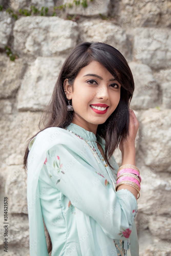 Bracelets on the girl's hands. Traditional accessories of Indian girls. Girl in traditional Indian clothing, salwar kameez. Bracelets on the girl's hands. Traditional accessories of Indian girls. Girl in traditional Indian clothing, salwar kameez.