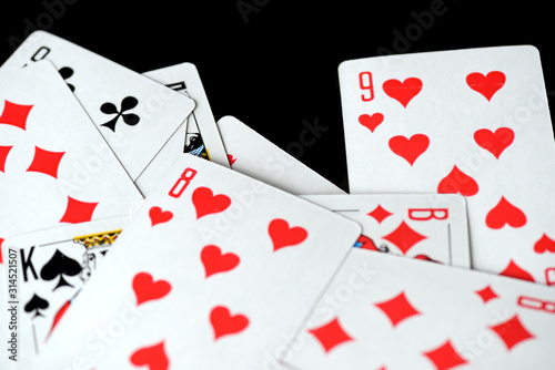 Playing cards on a black background close-up. Gambling Concept