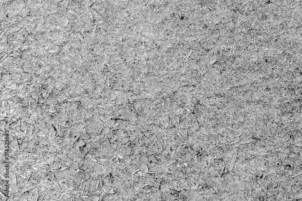 An old sheet of plywood with fragments of pressed sawdust gray. An old sheet of plywood with fragments of pressed sawdust gray.