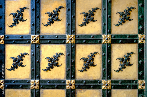 A fragment of the ancient gate of the castle. texture and medieval ornament photo