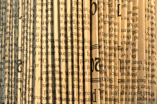 Abstract folded old paper with English text