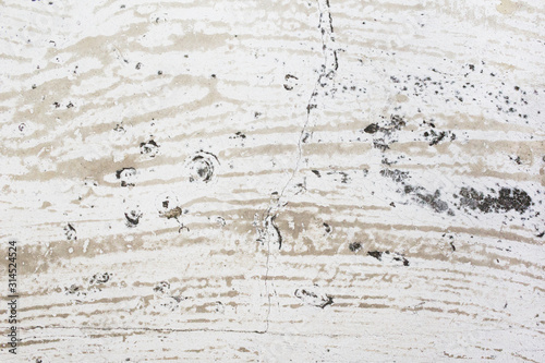 Stain and mold on an old dirty white concrete surface