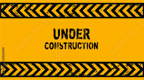 yellow warning sign. Website under condtruction background.