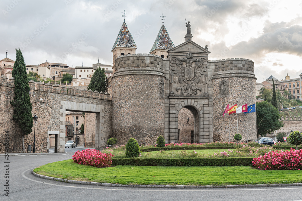 Ancient city walls and gate of Toledo, Spain. One of the main gates to enter the old city of Toledo in Spain