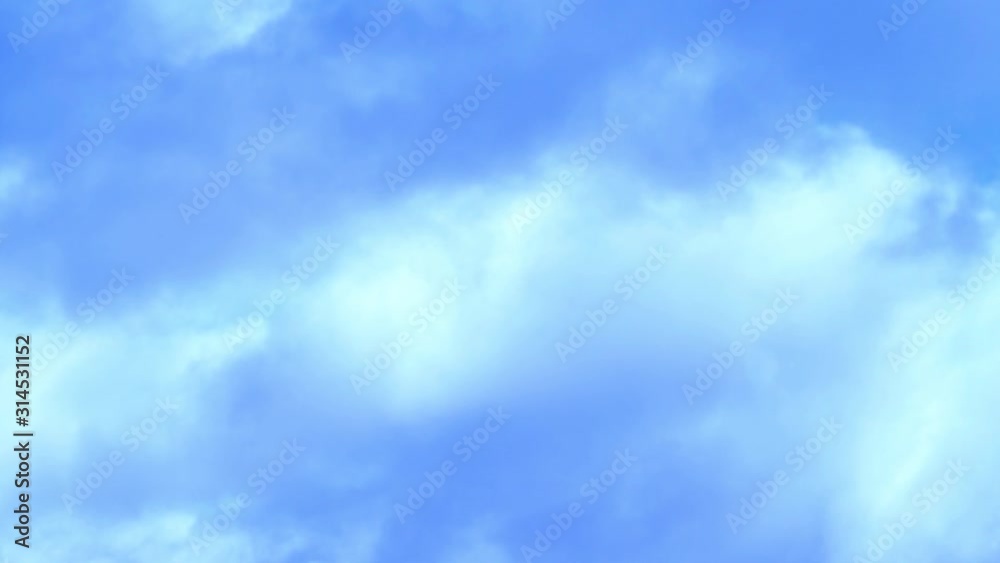 moving gray cloud over blurred blue sky. moving gray cloud over blurred blue sky.