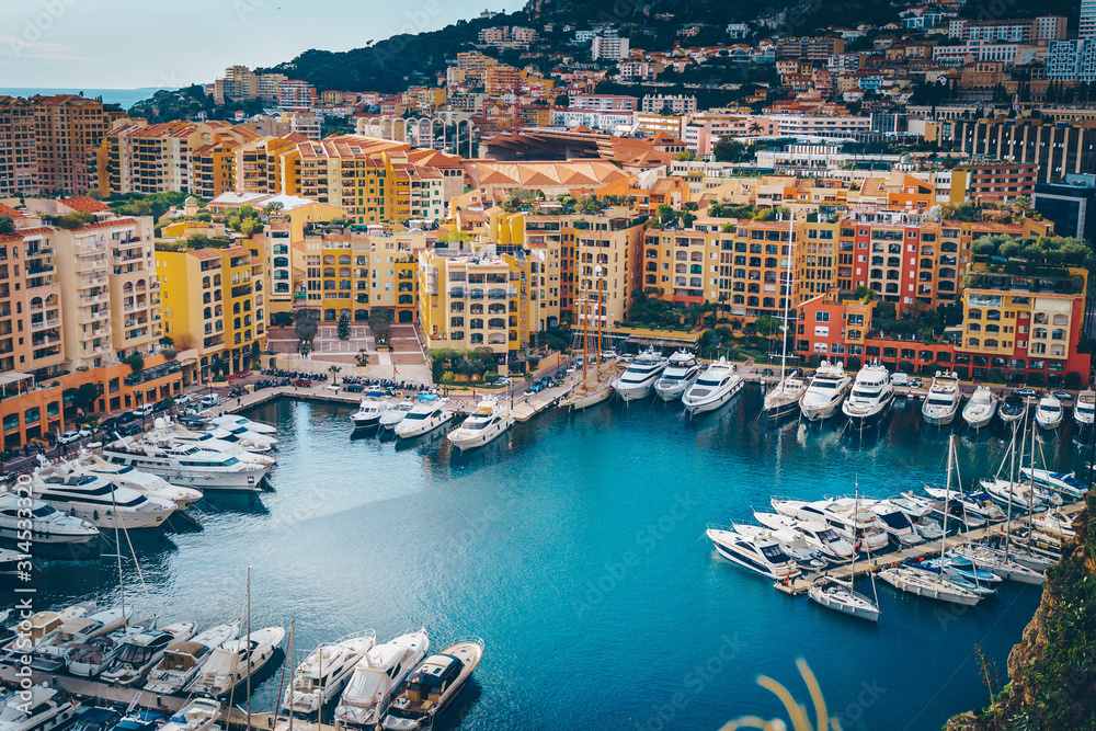 Monaco Fontvieille cityscape of French Riviera. topview from Monaco Ville, azure water, harbor, luxury apartments, yachts. Port Fontvieille.