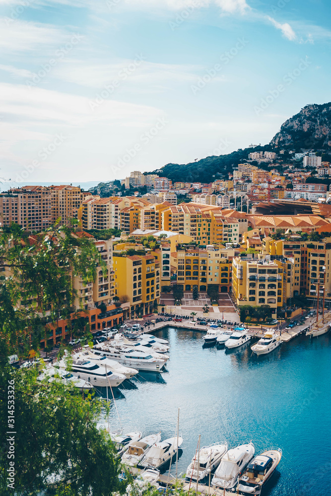 Aerial view of Monaco port. Port Fontvieille, Monaco Ville, topview from Monaco Ville, azure water, harbor, luxury apartments, yachts. view of yachts in Port Hercules, Monaco. Vertical size