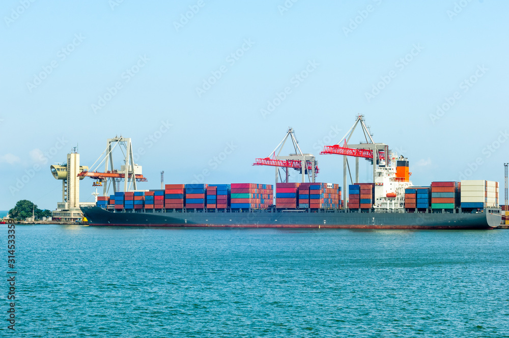 Unloading freight from container ship in Odessa port terminal, Ukraine
