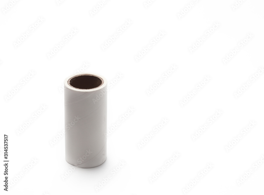 One spare tape for cleaning roller, for cleaning clothes or fabric from animal hair or fur. Isolated white background One spare tape for cleaning roller, for cleaning clothes or fabric from animal hair or fur. Isolated white background