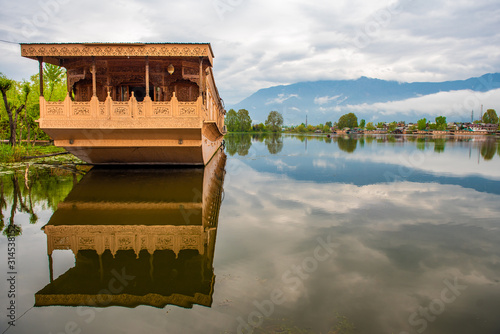 Boat house in the lake for tourist services in Srinagar Kashmir, India. photo
