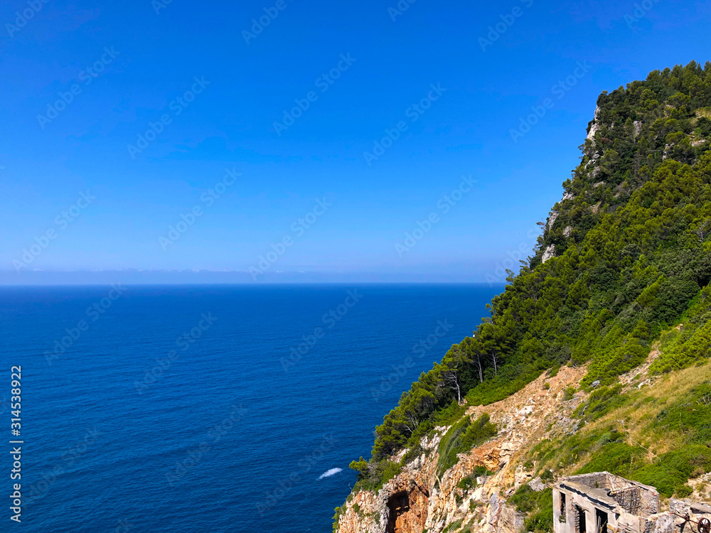 Portovenere cliff with blue sky and sea